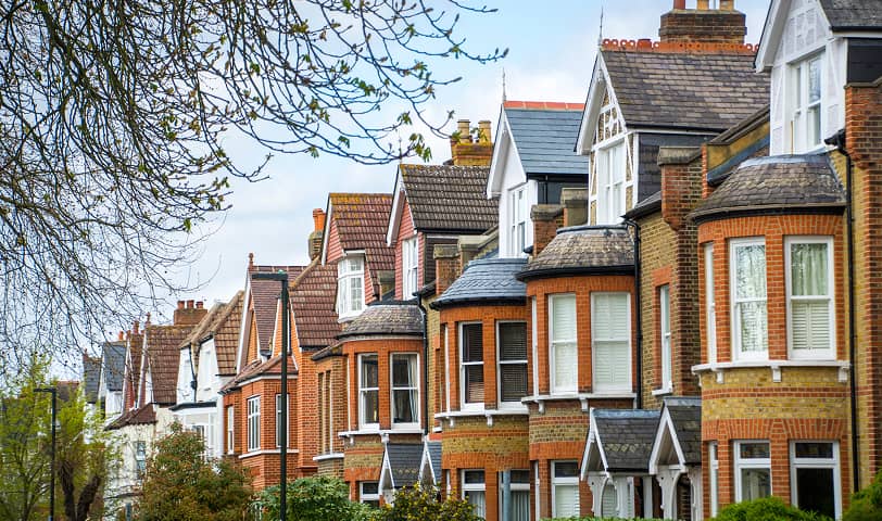 Street lined with terraced houses.